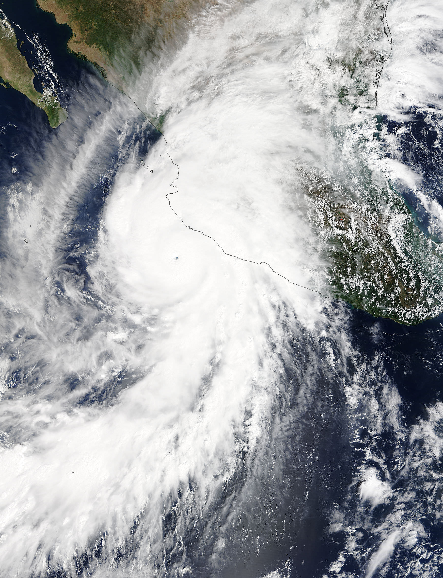 On Oct. 23 at 17:30 UTC (1:30 p.m. EDT) NASA's Terra satellite saw the eastern quadrant of Hurricane Patricia over Mexico and the storm's pinhole eye.  Credits: NASA's Goddard MODIS Rapid Response Team