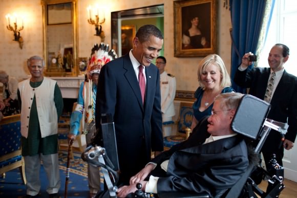 President Barack Obama talks with Stephen Hawking in the Blue Room of the White House before a ceremony presenting him and 15 others the Presidential Medal of Freedom, August 12, 2009. The Medal of Freedom is the nation's highest civilian honor. (Official White House photo by Pete Souza)