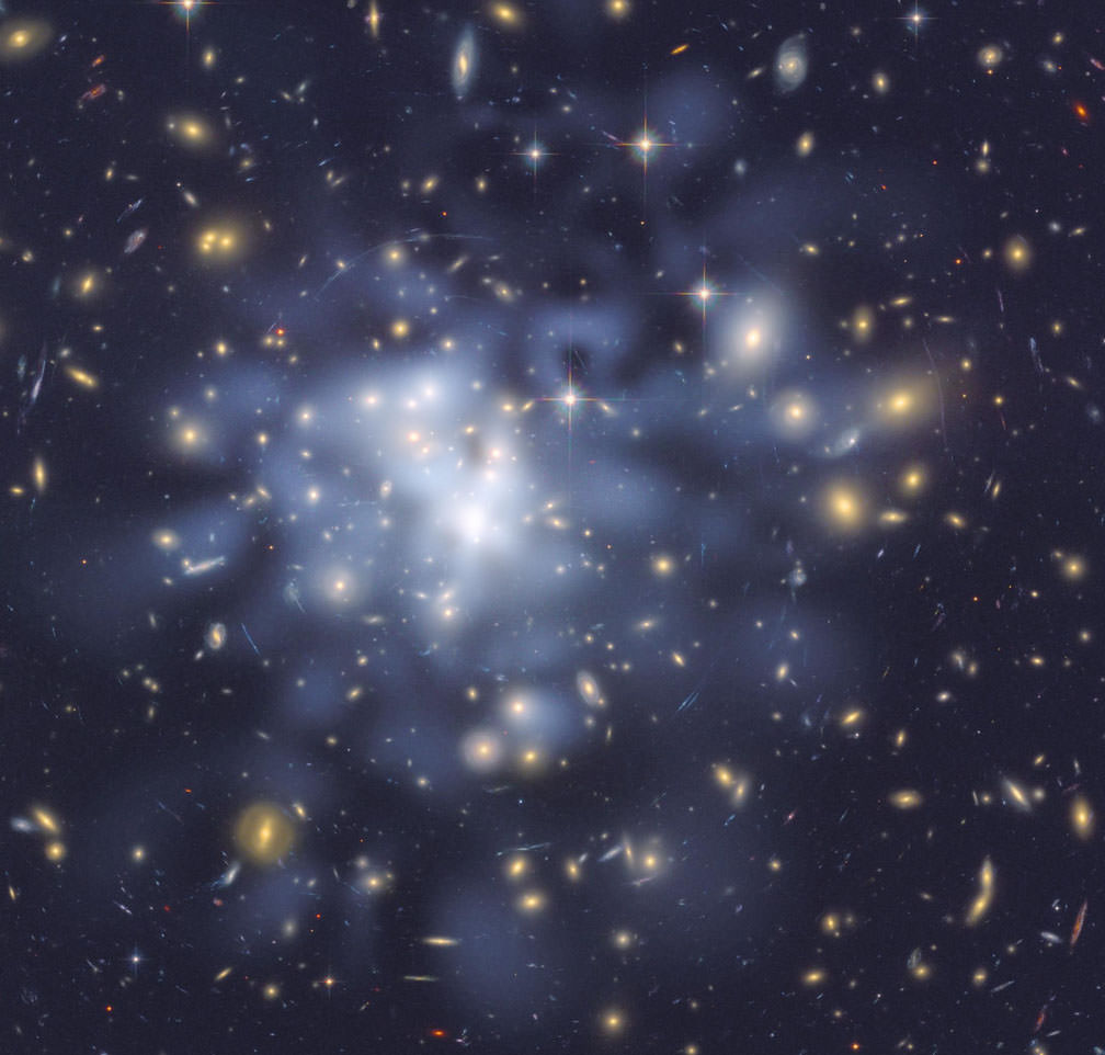 This NASA Hubble Space Telescope image shows the distribution of dark matter in the center of the giant galaxy cluster Abell 1689, containing about 1,000 galaxies and trillions of stars.