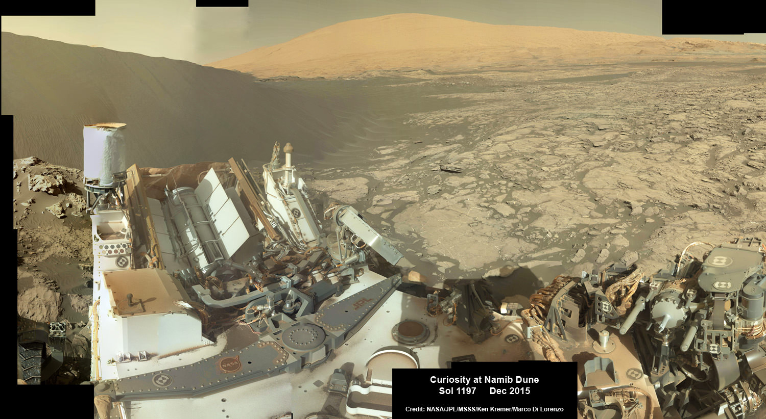 Curiosity explores Red Planet paradise at Namib Dune during Christmas 2015 - backdropped by Mount Sharp.  Curiosity took first ever self-portrait with Mastcam color camera after arriving at the lee face of Namib Dune.  This photo mosaic shows a portion of the full self portrait and is stitched from Mastcam color camera raw images taken on Sol 1197, Dec. 19, 2015.  Credit: NASA/JPL/MSSS/Ken Kremer/kenkremer.com/Marco Di Lorenzo