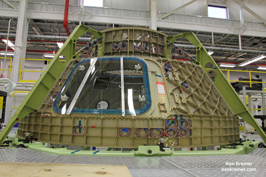 View of upper dome and newly attached crew access tunnel of the first Boeing CST-100 ‘Starliner’ crew  spaceship under assembly at NASA’s Kennedy Space Center.   This is part of the maiden Starliner crew module known as the Structural Test Article (STA) being built at Boeing’s refurbished Commercial Crew and Cargo Processing Facility (C3PF) manufacturing facility at KSC. Numerous strain gauges have been installed for loads testing. Credit: Ken Kremer /kenkremer.com
