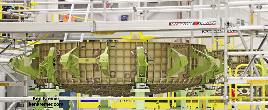 View of lower dome of the first Boeing CST-100 ‘Starliner’ crew  spaceship (left) and upper dome tunnel (right) under assembly at NASA’s Kennedy Space Center and known as the Structural Test Article (STA), with many strain gauges installed.  The Starliner STA is being built at Boeing’s Commercial Crew and Cargo Processing Facility (C3PF) manufacturing facility at KSC. Credit: Ken Kremer /kenkremer.com
