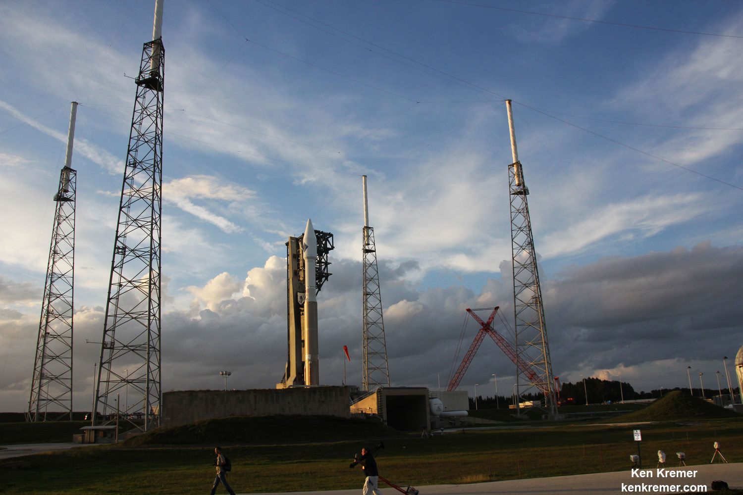 Sunset view of Orbital ATK Cygnus CRS-4 spacecraft at Space Launch Complex 41 poised for blastoff  to ISS on ULA Atlas V on Dec. 3, 2015 from Cape Canaveral Air Force Station, Florida.  Atlas V rocket stands adjacent to new commercial crew access tower for astronaut launching on Boeing Starliner space taxi starting in 2017.  Credit: Ken Kremer/kenkremer.com