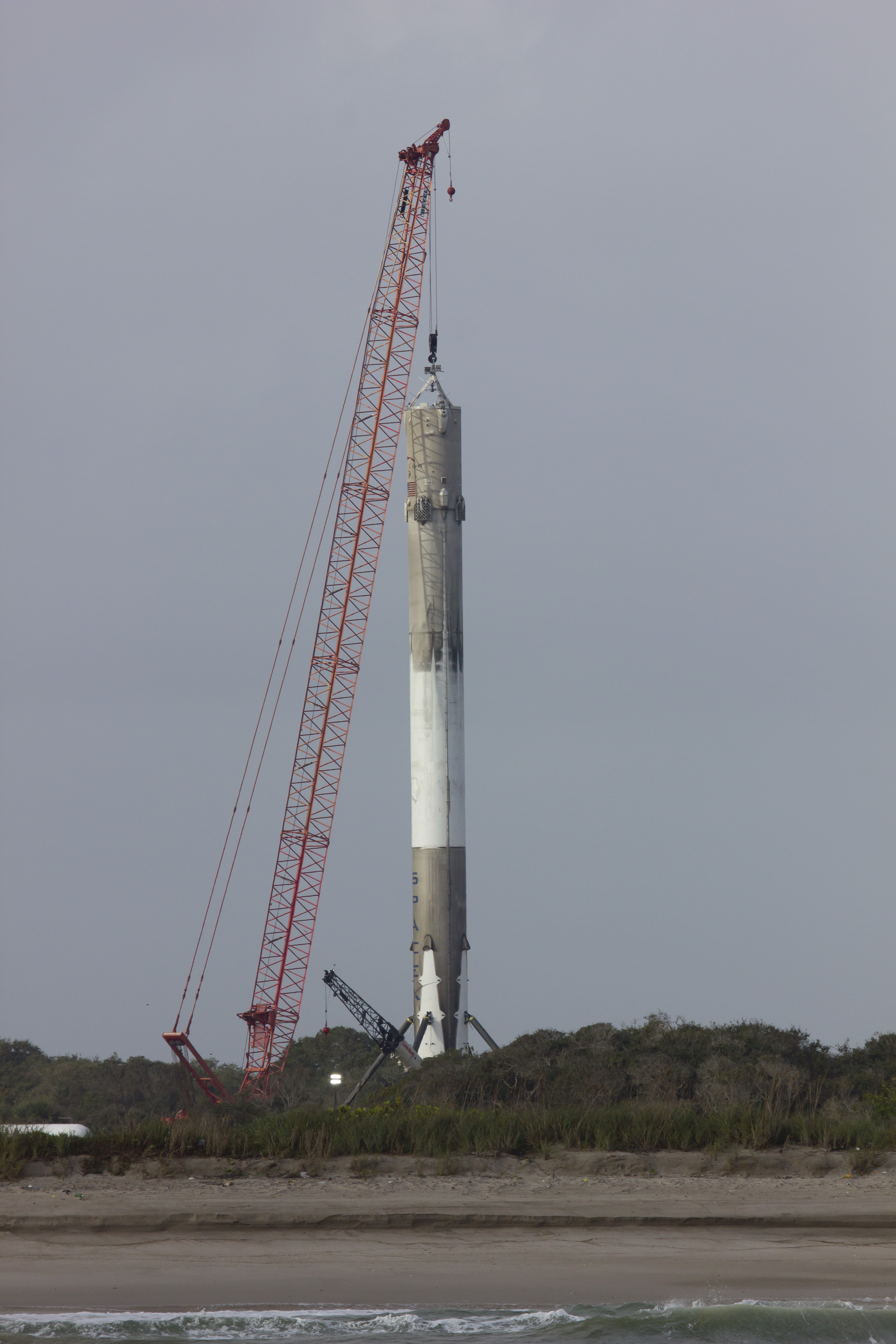 Up close post landing ocean view of SpaceX Falcon 9 at Landing Zone 1 the day after first stage touchdown at Landing Zone 1 on Dec 21, 2015 at Cape Canaveral, Fla.  Credit: Jeff Seibert/AmericaSpace