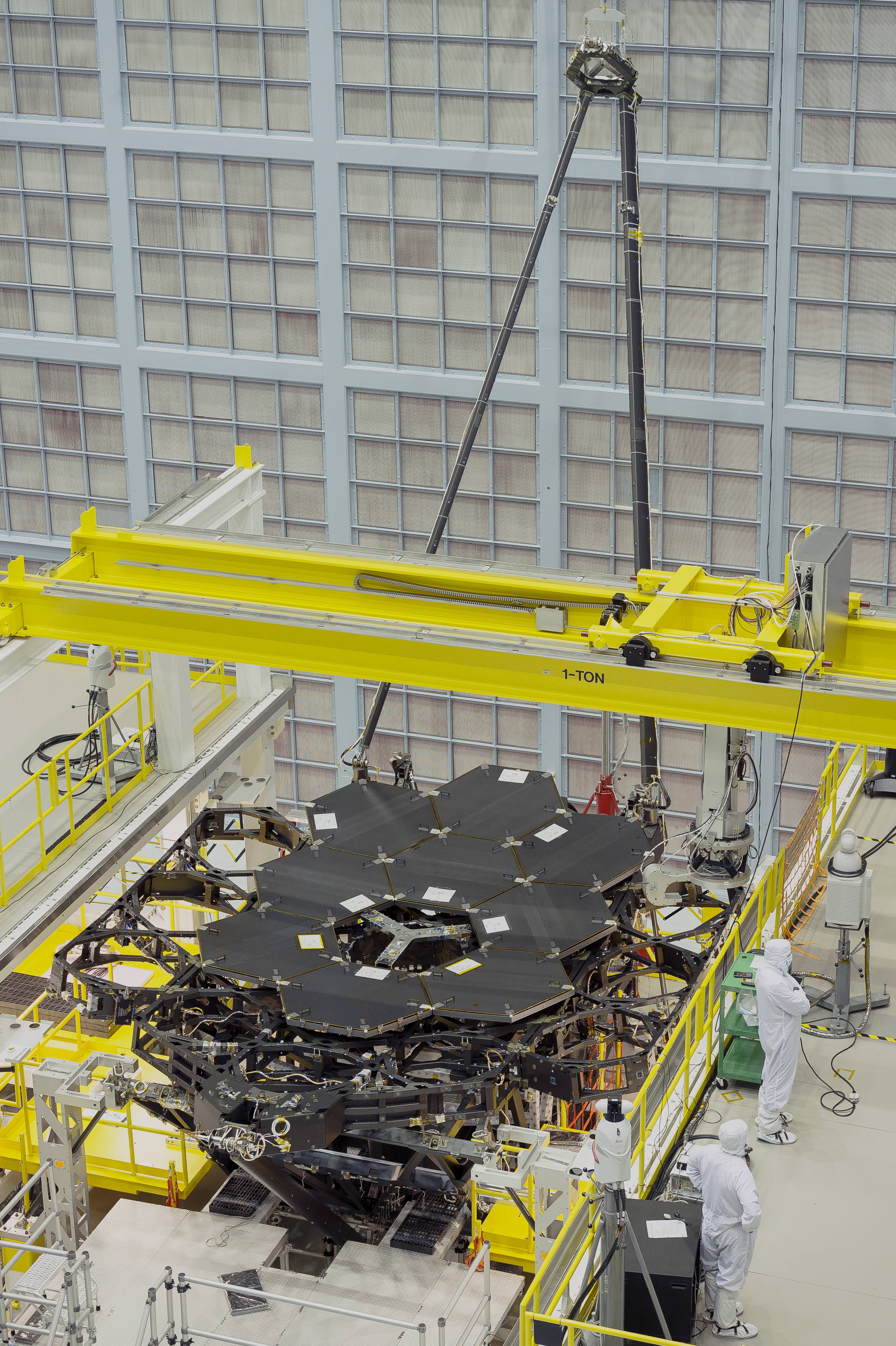Nine of the James Webb Space Telescope's 18 primary flight mirrors have been installed on the telescope structure. This marks the halfway point in the James Webb Space Telescope's primary mirror installation.  Credits: NASA's Goddard Space Flight Center/Chris Gunn