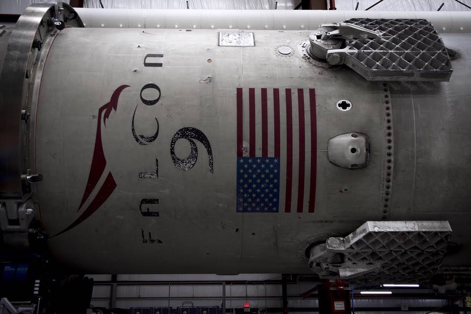 Up close view of upper portion of recovered Falcon 9 first stage inside processing hanger at pad 39A hangar at Kennedy Space Center following launch and recovery on Dec. 21, 2015.  Credit: SpaceX