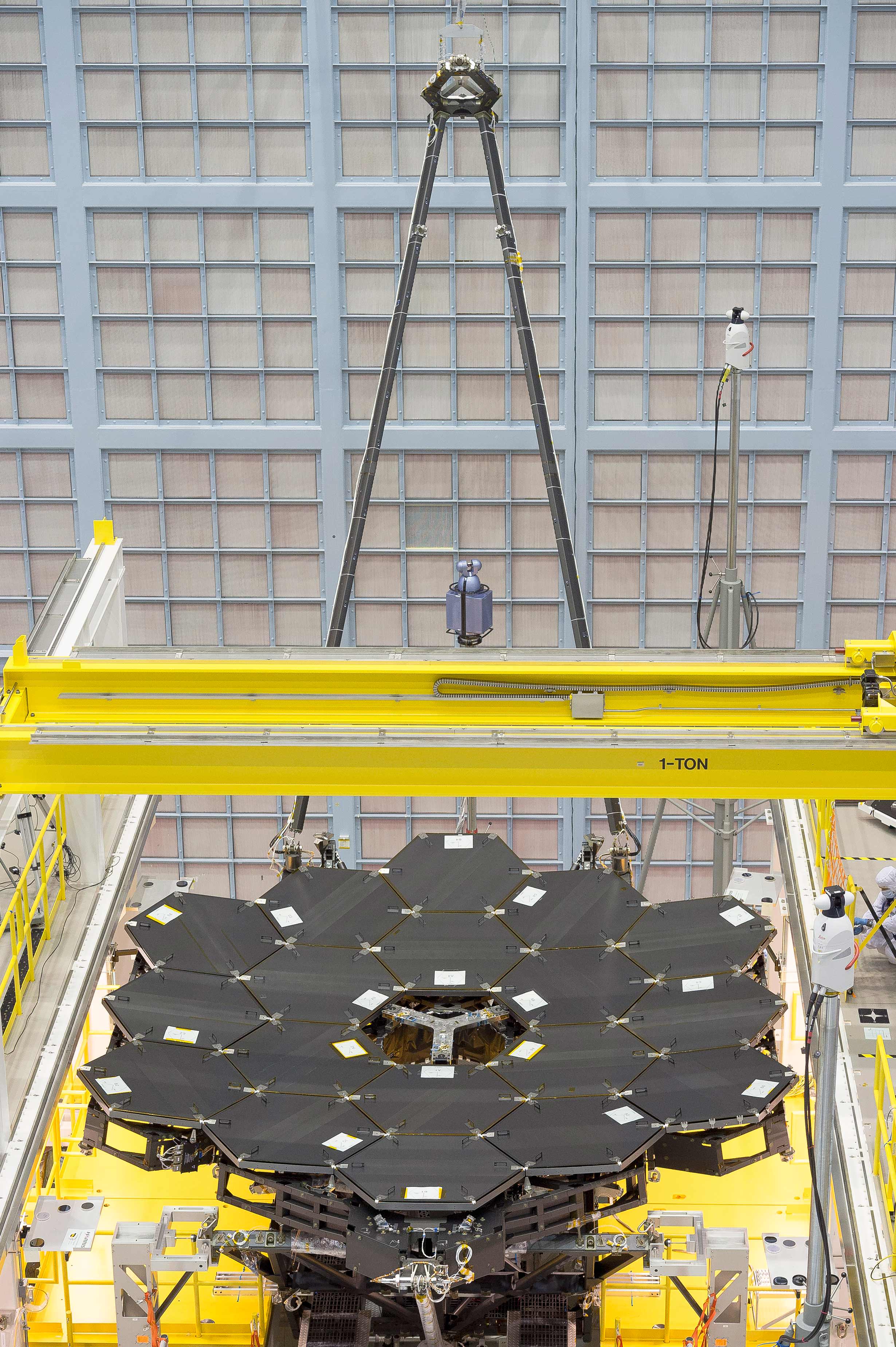 In this rare view, the James Webb Space Telescope's 18 mirrors are seen fully installed on the James Webb Space Telescope structure at NASA's Goddard Space Flight Center in Greenbelt, Maryland.  Credits: NASA/Chris Gunn