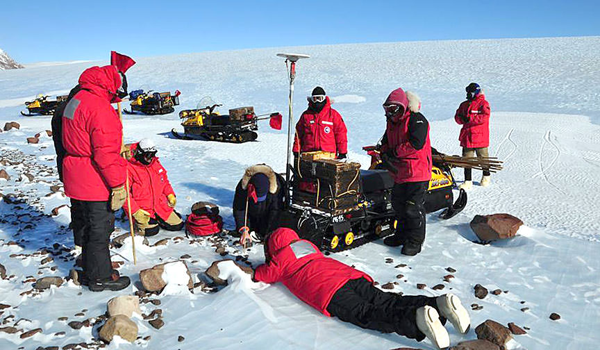 A team of scientists document the find of a small meteorite found among rocks on the Antarctic ice during the ANSMET 2014-15 hunt. Credit: JSC Curation / NASA