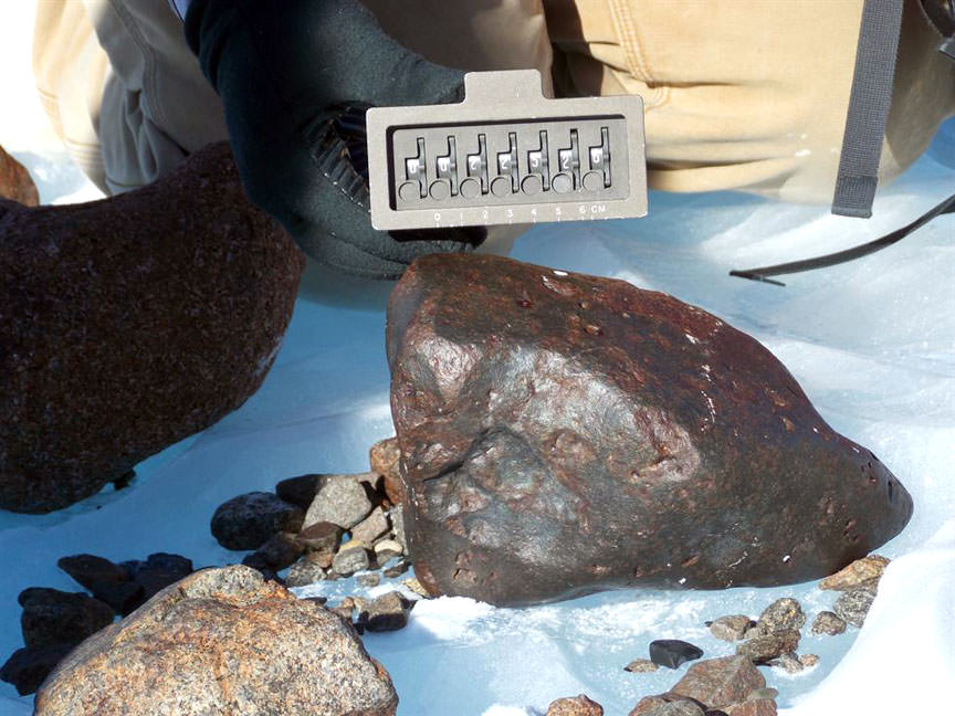 A likely stony meteorite found during the ANSMET 2014-15 expedition in Antarctica. Credit: JSC Curation / NASA