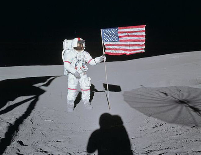 Edgar Mitchell stands by the U.S. flag he and fellow astronaut Alan Shepard planted on the Fra Mauro region of the moon back in February 1971. Credit: NASA