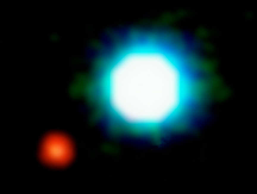 This is a composite image of the brown dwarf object 2M1207 (centre) and the fainter object seen near it, at an angular distance of 778 milliarcsec. Designated "Giant Planet Candidate Companion" by the discoverers, it may represent the first image of an exoplanet. Further observations, in particular of its motion in the sky relative to 2M1207 are needed to ascertain its true nature. The photo is based on three near-infrared exposures (in the H, K and L' wavebands) with the NACO adaptive-optics facility at the 8.2-m VLT Yepun telescope at the ESO Paranal Observatory.