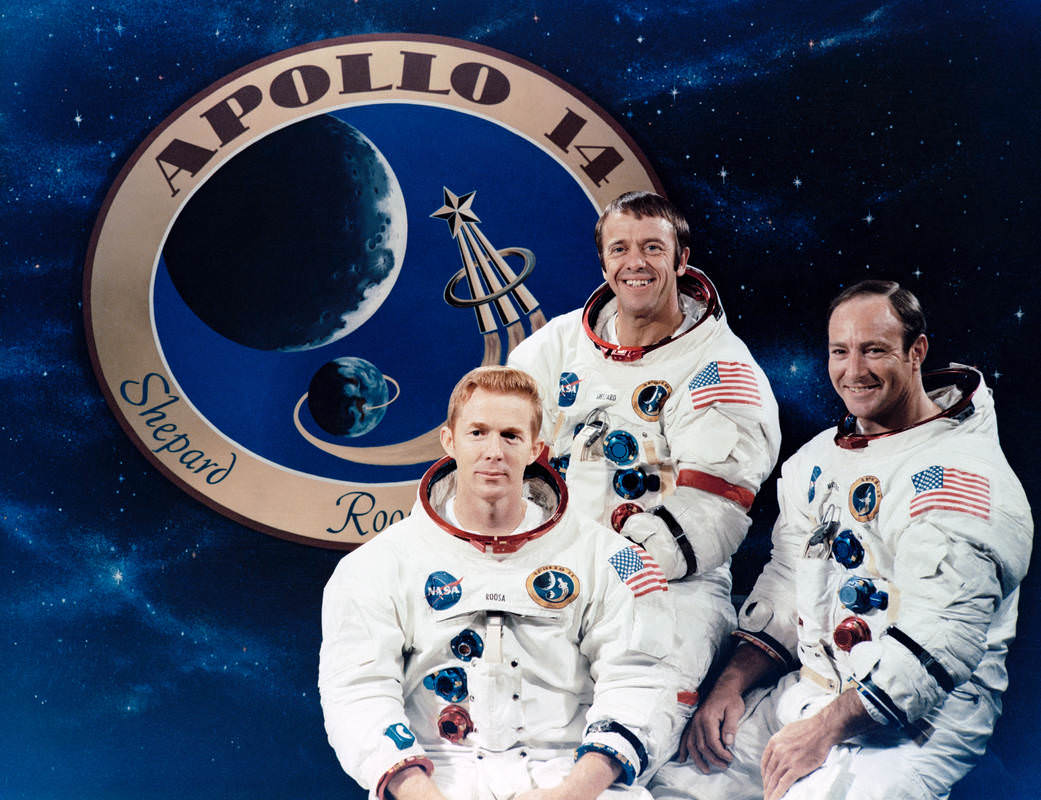 These three astronauts are the prime crew of the Apollo 14 lunar landing mission. They are Alan B. Shepard Jr., center, commander; Stuart A. Roosa, left, command module pilot; and Edgar D. Mitchell, lunar module pilot. The Apollo 14 emblem is in the background.  Credit: NASA