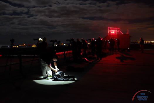 Photographers on the VAB roof at KSC, preparing for Atlas V/Cygnus launch on March 22, 2016.  Credit: Jared Haworth