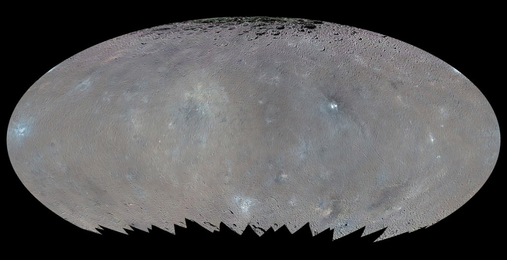 This global map shows the surface of Ceres in enhanced color, encompassing infrared wavelengths beyond human visual range. Images taken using infrared (965 nanometers), green (555 nanometers) and blue (438 nanometers) spectral filters were combined to create this view. Credit: NASA/JPL-Caltech/UCLA/MPS/DLR/IDA/PSI