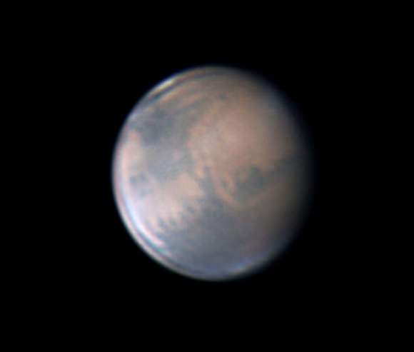 Mars, in gibbous phase, is still small but starting to show its larger surface features in modest-sized telescopes. This photo, taken on March 13th, shows the  prominent Mare  Acidalium in the planet's northern hemisphere (top) and a hint of the north polar cap. Sinus Aurorae and Mare Erythraeum dominate the south. Credit: Anthony Wesley