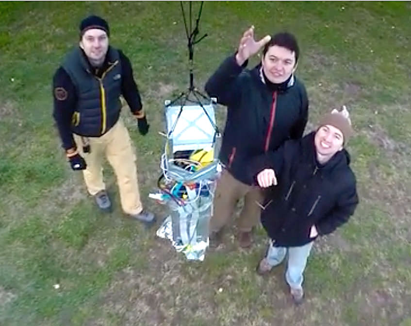 Moscow University students release the satellite on a test run. Credit: cosmomayak.ru / Mayak Project