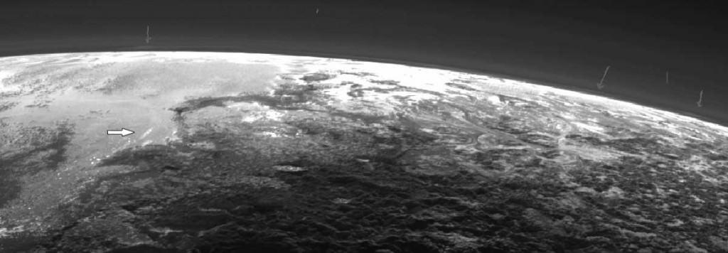 Faint arrows along Pluto's limb point to possible clouds in a low altitude haze layer. More distinct possible clouds are arrowed at left. Credit: NASA/JHUAPL/SwR