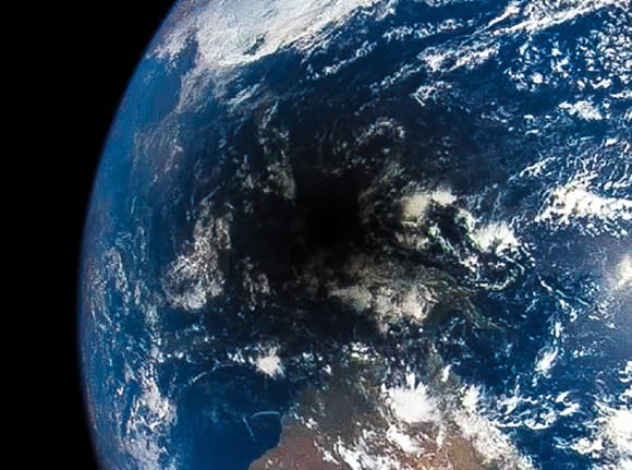 The Moon's shadow during a total eclipse looks like a black hole on the Earth (no actual singularities were involved.) 