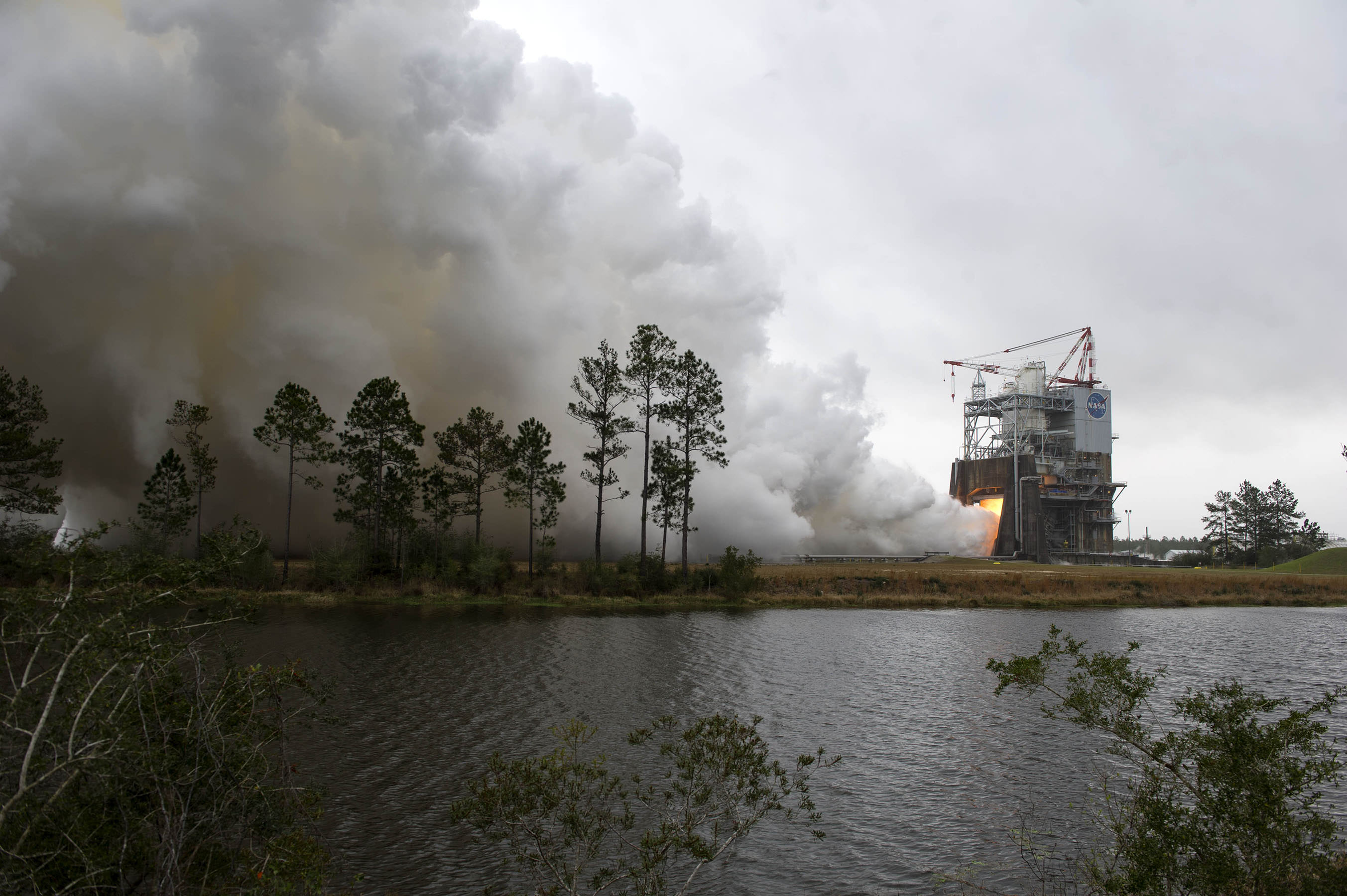 NASA engineers conduct a successfully test firing of RS-25 rocket engine No. 2059 on the A-1 Test Stand at NASA’s Stennis Space Center in Bay St. Louis, Mississippi. The hot fire marks the first test of an RS-25 flight engine for NASA’s new Space Launch System vehicle.  Credits: NASA/SSC