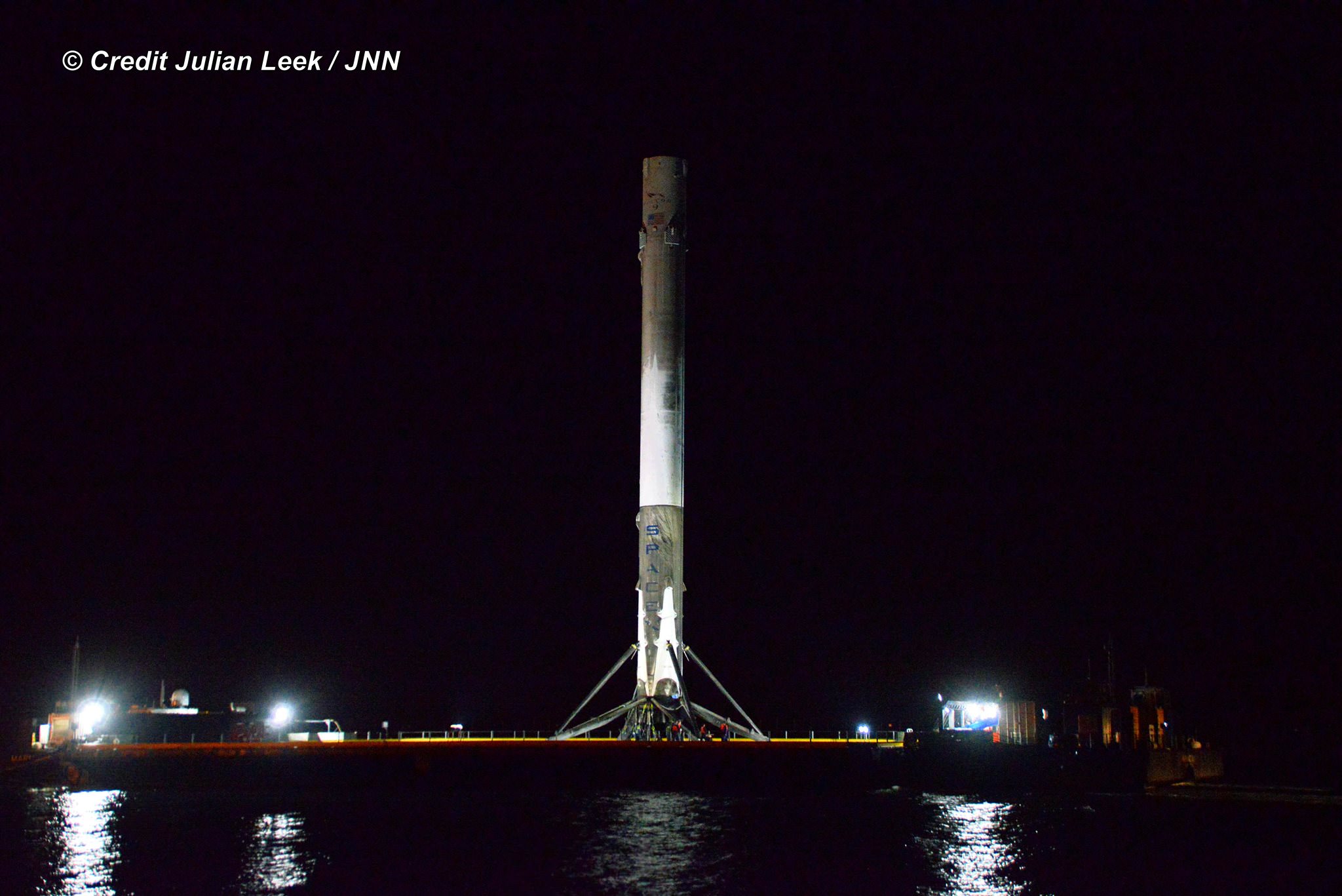 Recovered SpaceX Falcon 9 rocket arrives back in port overnight at Port Canaveral, Florida on April 12, 2016 following successful launch and landing on April 8 from Cape Canaveral Air Force Station.  Credit: Julian Leek