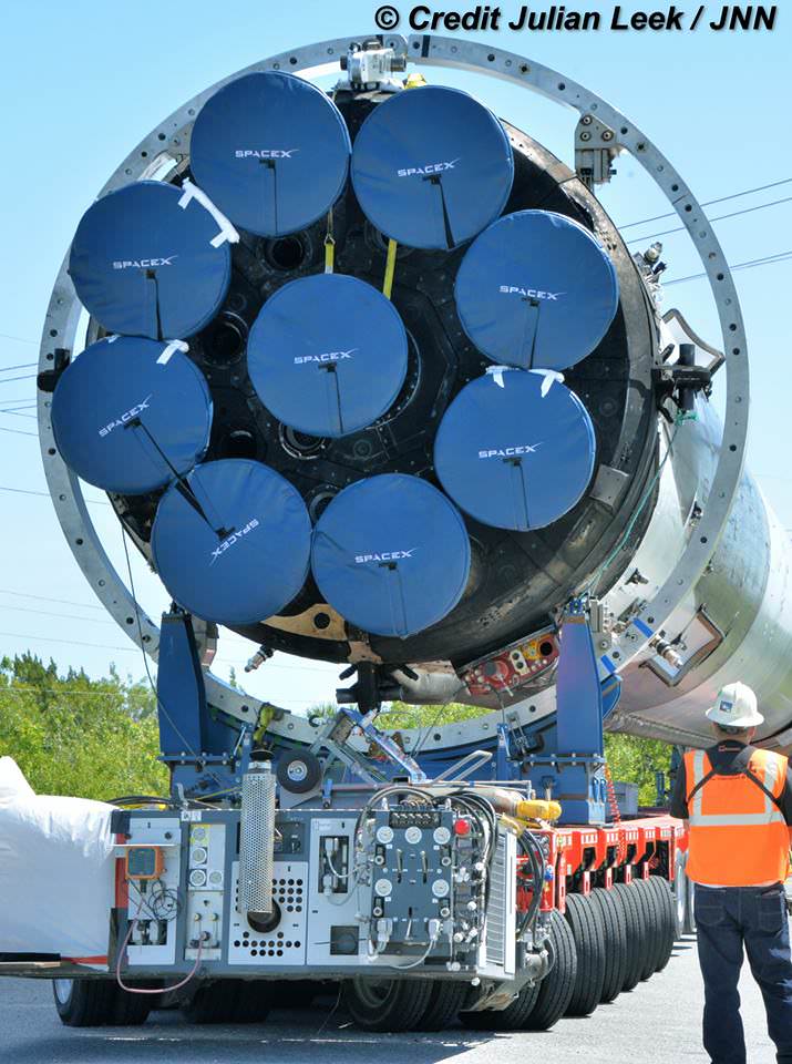 The nine Merlin 1 D engines that power SpaceX Falcon 9 are positioned in an octoweb arrangement, as shown in this up close view of the base of recovered first stage during transport to Kennedy Space Center pad 39 A from Port Canaveral, Florida on April 19, 2016. Credit: Julian Leek
