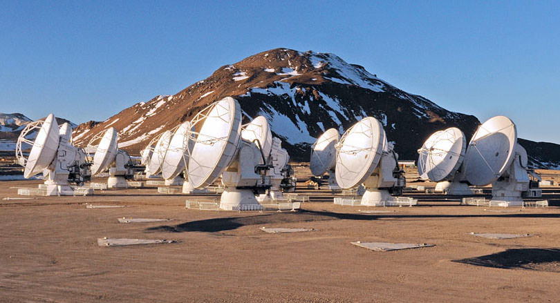 This photo of the ALMA antennas on the Chajnantor Plateau in Chile, more than 16,000 feet (5000 meters) above sea level, was taken a few days before the start of ALMA Early Science and shows only one cluster of the 66 dishes. ALMA views the sky in "submillimeter" light, a slice of the spectrum invisible to the human eye that lies between infrared and radio waves. Credit: ALMA (ESO/NAOJ/NRAO)/W. Garnier (ALMA)