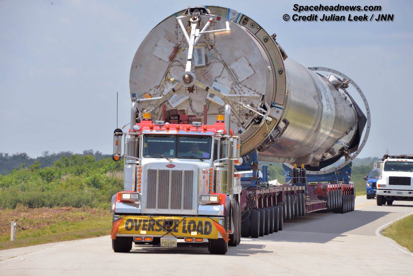 First stage booster with landing legs removed from SpaceX JCSAT-14 launch was transported horizontally to SpaceX hangar at pad 39A at the Kennedy Space Center, Florida on May 16, 2016. Credit: Julian Leek