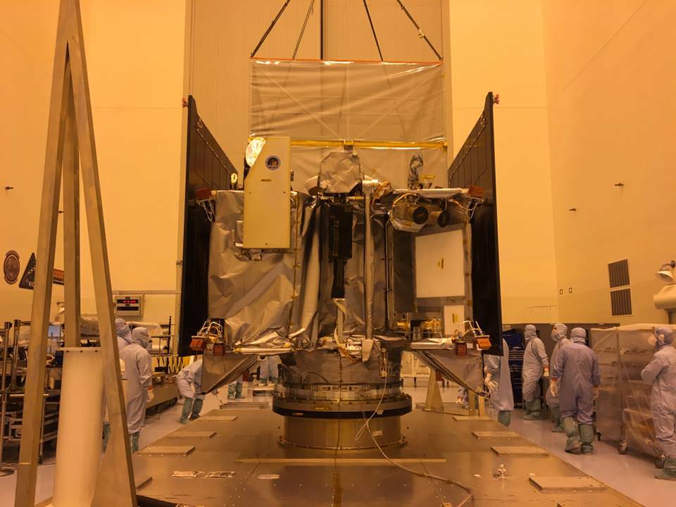 Inside the Payloads Hazardous Servicing Facility high bay at NASA's Kennedy Space Center, engineers are removing “the birdcage” a soft, protective cover from over the Osiris-REx spacecraft.  Credit: NASA