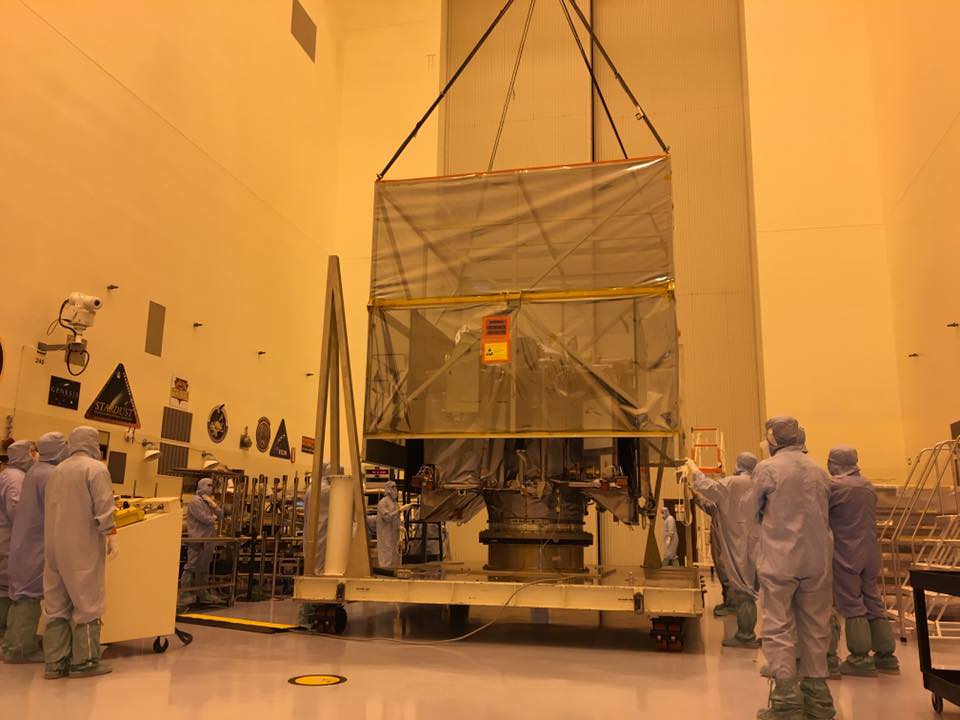 Inside the Payloads Hazardous Servicing Facility high bay at NASA's Kennedy Space Center, engineers are removing “the birdcage” a soft, protective cover from over the Osiris-REx spacecraft.  Credit: NASA