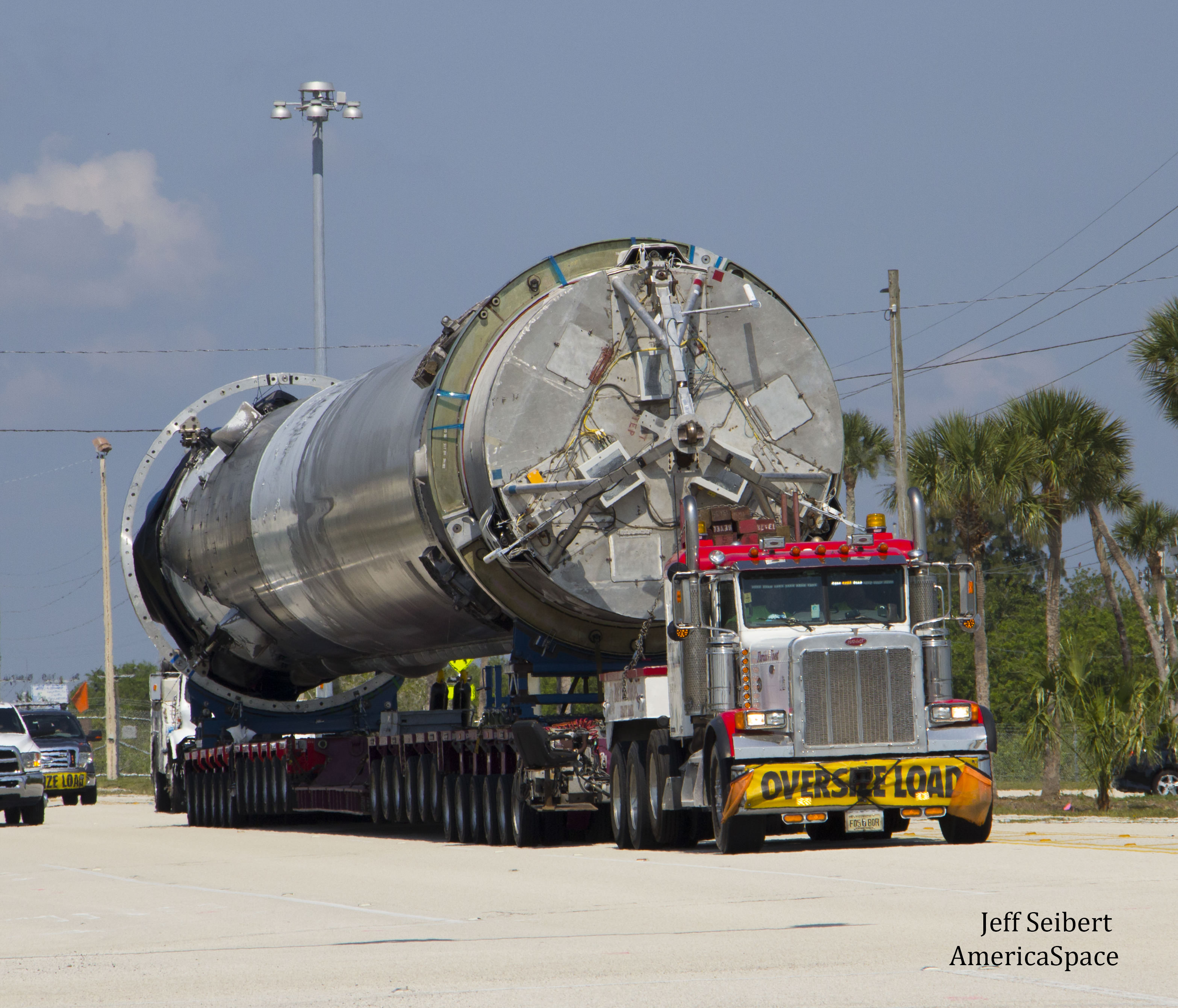 First stage booster from SpaceX JCSAT-14 launch was transported horizontally to SpaceX hangar at pad 39A at the Kennedy Space Center, Florida on May 16, 2016. Credit: Jeff Seibert/AmericaSpace
