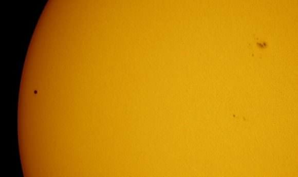 The black dot of Mercury, along with a lone sunspot group currently turned Earthward. Image credit and copyright: @Blobrana