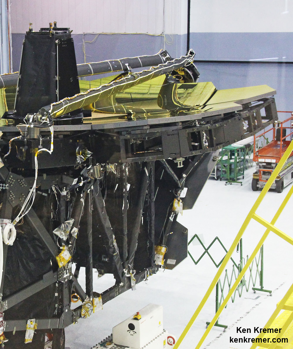Up close view shows cone shaped Aft Optics Subsystem (AOS) standing at center of Webb telescopes 18 segment primary mirror at NASA's Goddard Space Flight Center in Greenbelt, Maryland on May 3, 2016.  ISIM science instrument module will be installed inside truss structure below.  Credit: Ken Kremer/kenkremer.com