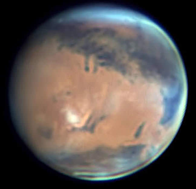 Mars on May 2 shows Syrtis Major off to the east (right). Crossing the top of the photo are Mare Tyrrhenum to the right of the planet's central meridian and Mare Cimmerium, to the left. Credit: Christopher Go