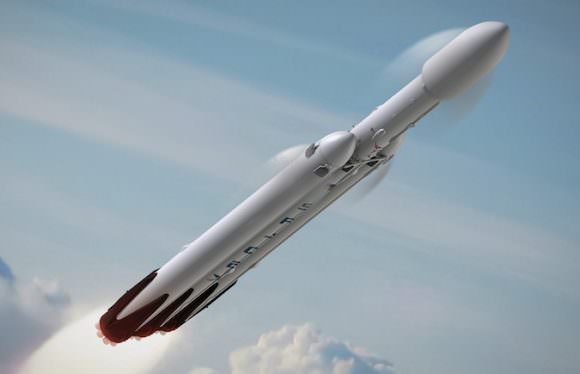 This artist's illustration of the Falcon Heavy shows the rocket in flight prior to releasing its two side boosters. Image: SpaceX