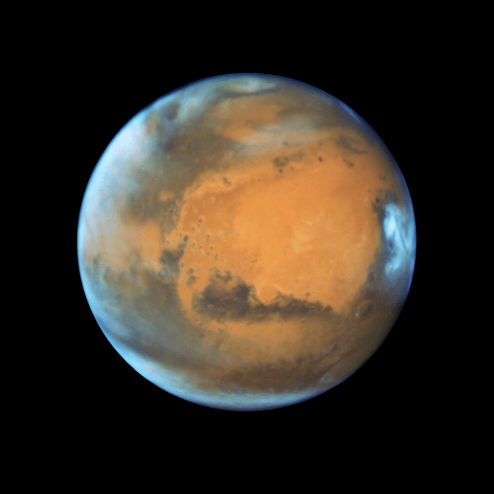 Mars in all its red-hued glory. Image: NASA, ESA, the Hubble Heritage Team (STScI/AURA), J. Bell (ASU), and M. Wolff (Space Science Institute)