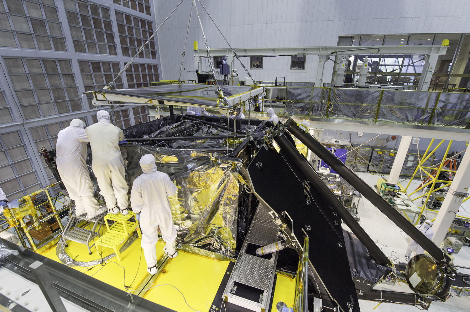 This side shot shows a glimpse inside a massive clean room at NASA's Goddard Space Flight Center in Greenbelt, Maryland where the James Webb Space Telescope team worked meticulously to complete the science instrument package installation.  Credits: NASA/Desiree Stover