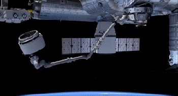 This sped-up animation shows the ISS's robotic arm removing the uninflated BEAM from the Dragon capsule and attaching it to the station. Credit: NASA