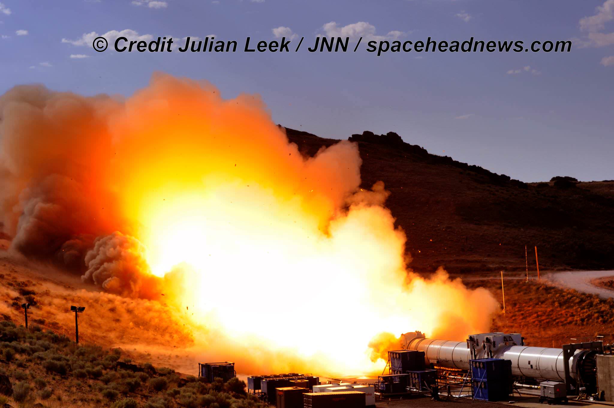 Ignition of the qualification motor (QM-2) booster during test firing for NASA’s Space Launch System as seen on Tuesday, June 28, 2016, at Orbital ATK Propulsion System's (SLS) test facilities in Promontory, Utah.  Credit: Julian Leek 