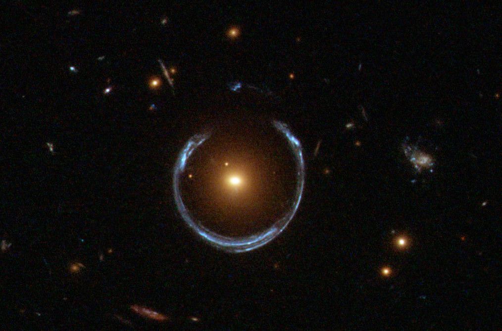 Another Einstein Ring. This one is named LRG 3-757. This one was discovered by the Sloan Digital Sky Survey, but this image was captured by Hubble's Wide Field Camera 3. Image: NASA/Hubble/ESA