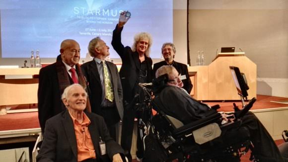 Professor Hawking, flanked by , announcing the launch of the Stephen Hawking Medal for Science Communication, Dec. 16th, 2015. Credit: 