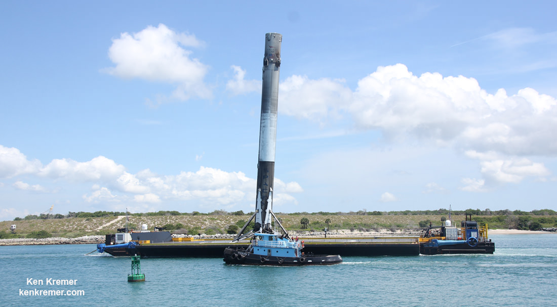 SpaceX Falcon 9 booster moving along the Port Canaveral channel after passing through mouth atop droneship platform on June 2, 2016 following Thaicom-8 launch on May 27, 2016.  Credit: Ken Kremer/kenkremer.com