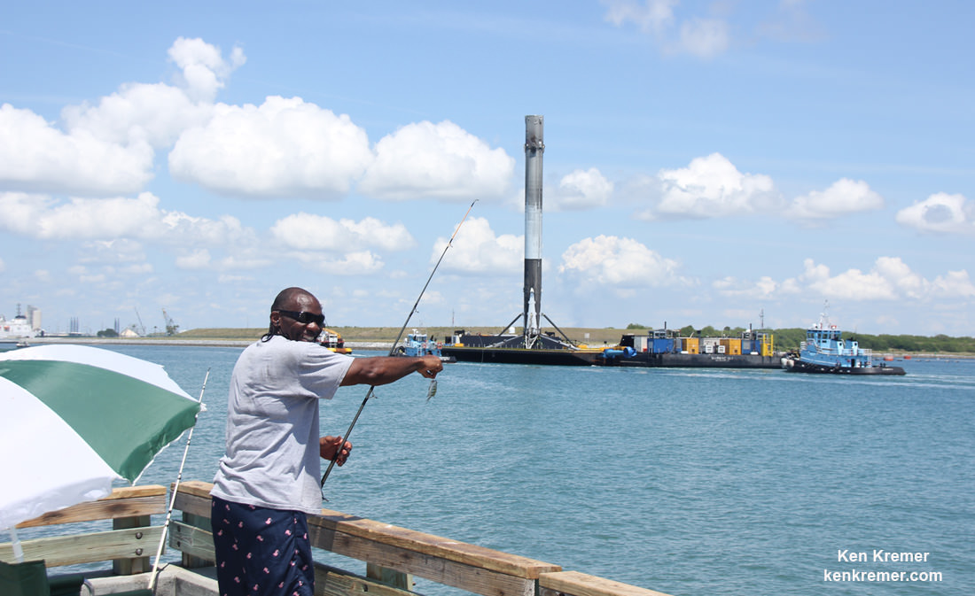 Proud fisherman displays ultra fresh ‘catch of the day’ as ultra rare species of SpaceX Falcon 9 rocket floats by simultaneously on barge in Port Canaveral, Fl, on June 2, 2016.  Credit: Ken Kremer/kenkremer.com