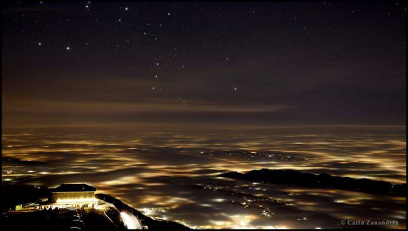 The second place winner in the ‘Against the Light’ category is Carlo Zanandrea from Italy for "All that Glitters is not Gold" taken in December 2015 showing constellation Orion rising over lights and fog in the province of Treviso in northeastern Italy. Credit and copyright: Carlo Zanandrea. 