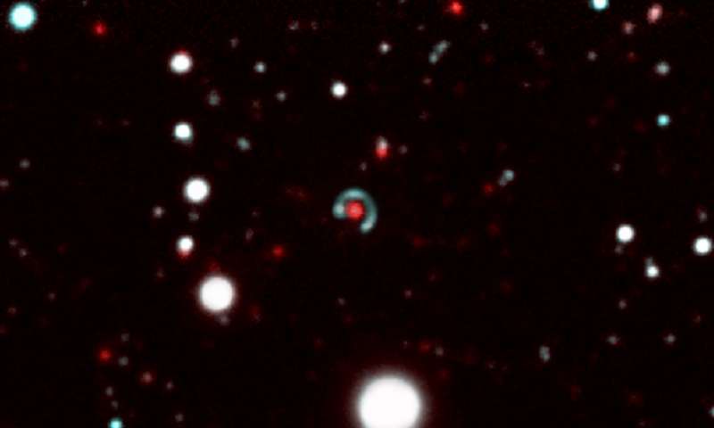 The "Canarias Einstein Ring." The green-blue ring is the source galaxy, the red one in the middle is the lens galaxy. The lens galaxy has such strong gravity, that it distorts the light from the source galaxy into a ring. Because the two galaxies are aligned, the source galaxy appears almost circular. Image: This composite image is made up from several images taken with the DECam camera on the Blanco 4m telescope at the Cerro Tololo Observatory in Chile.