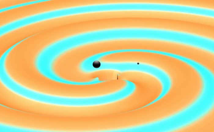 This image depicts two black holes just moments before they collided and merged with each other, releasing energy in the form of gravitational waves.  Image credit: Numerical Simulations: S. Ossokine and A. Buonanno, Max Planck Institute for Gravitational Physics, and the Simulating eXtreme Spacetime (SXS) project. Scientific Visualization: T. Dietrich and R. Haas, Max Planck Institute for Gravitational Physics.