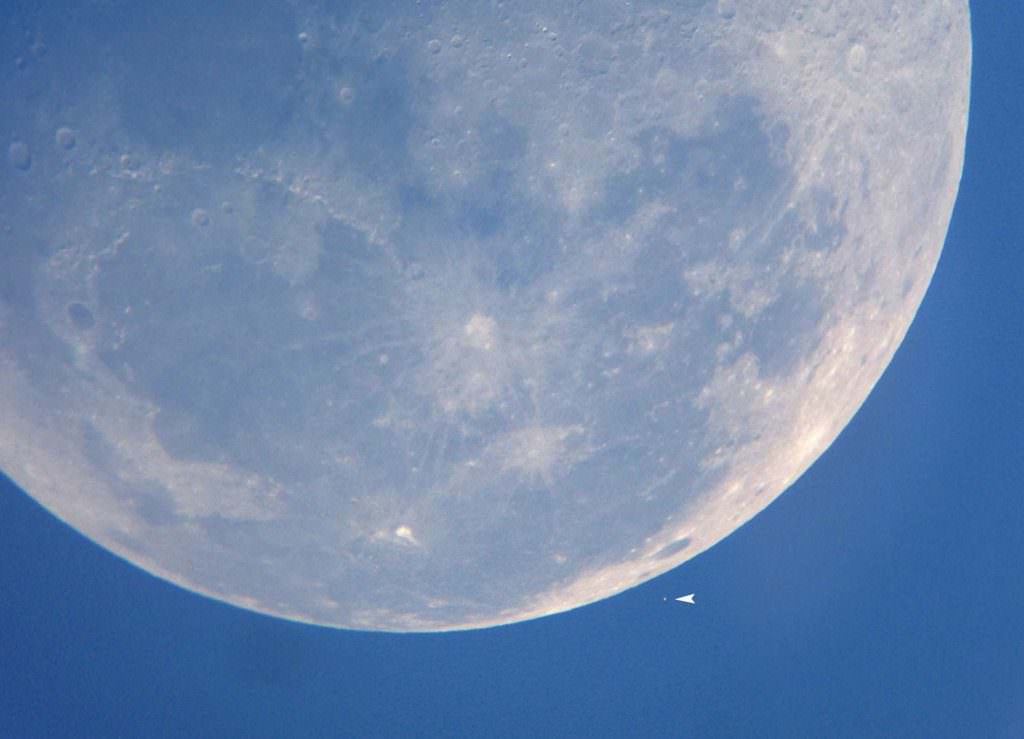 Aldebaran, the brightest star in Taurus the Bull hangs near the edge of the moon two minutes before it was covered up. The star was easily visible through the telescope. Credit: Bob King