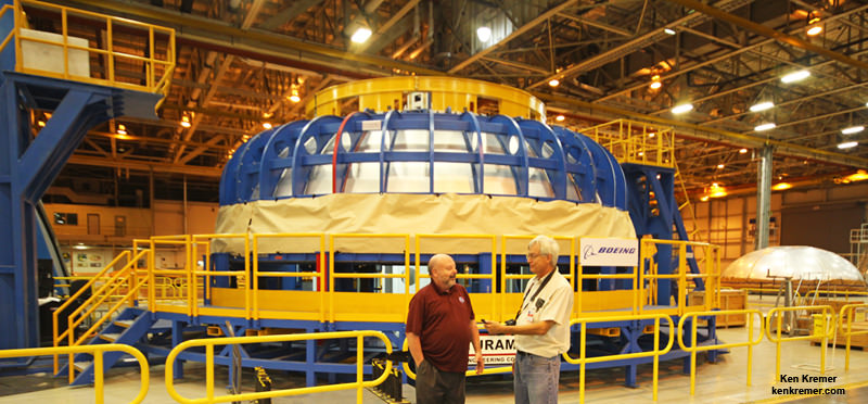 At NASA’s Michoud Assembly Facility in New Orleans, Patrick Whipps/NASA SLS Stages Element Manager and Ken Kremer/Universe Today discuss details of SLS manufacture by the Circumferential Dome Weld Tool used to fabricate dome segments for the SLS liquid hydrogen and oxygen core stage tanks.   Credit: Ken Kremer/kenkremer.com