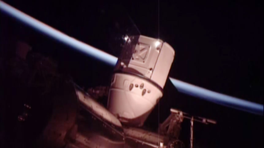The SpaceX Dragon is seen attached to the International Space Station’s Harmony module just before orbital sunrise. Credit: NASA TV