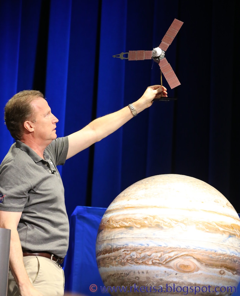 Rick Nybakken, Juno project manager at JPL illustrates how Juno will enter orbit around Jupiter during Juno mission briefing on July 4, 2016 at JPL. Credit: Roland Keller