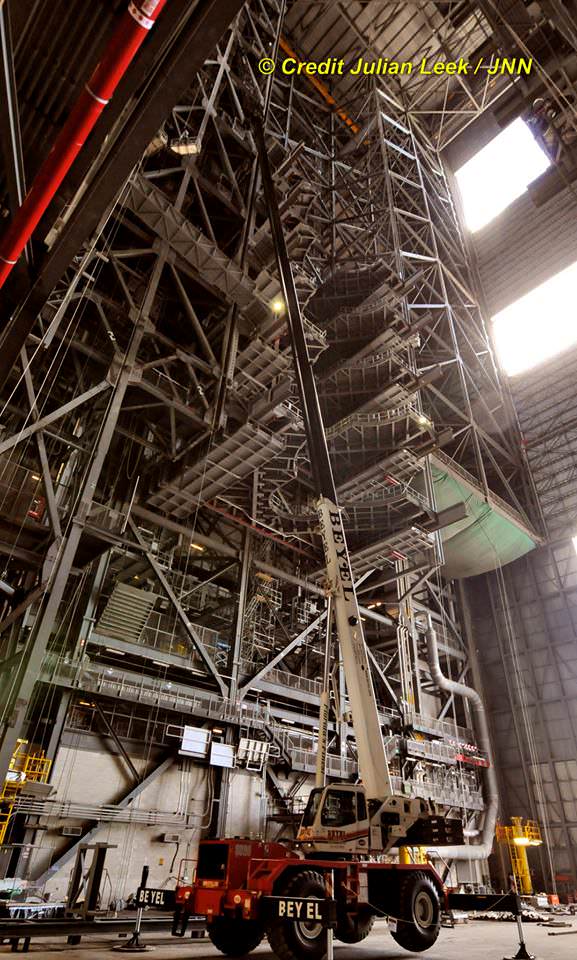 Looking up to the 5 pairs of newly installed massive work platforms inside High Bay 3 of the Vehicle Assembly Building on July 28, 2016.  Heavy duty cranes are used to install the new platforms which will enable access to assemble NASA’s SLS rocket at KSC in Florida.  Credit: Julian Leek